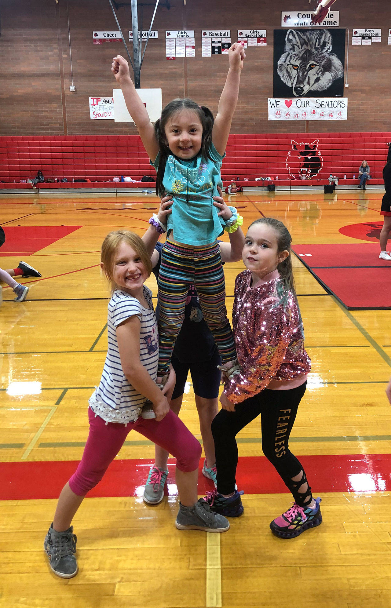 A trio of youngsters perform a stunt at the Coupeville Cheer Camp Sunday. (submitted photo)