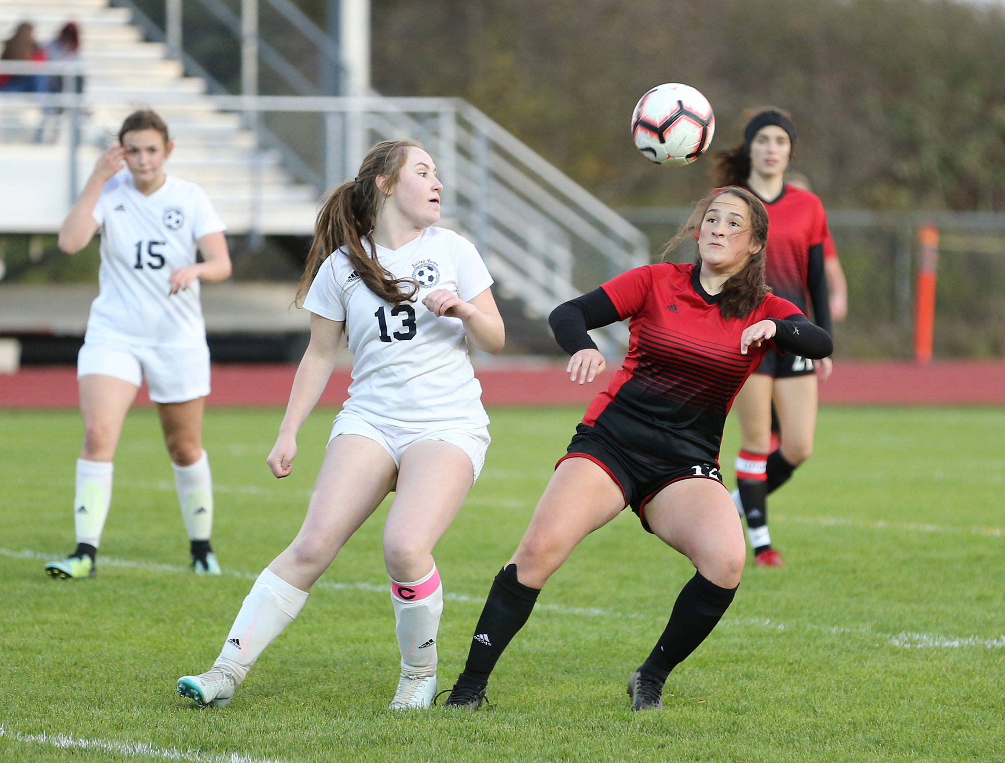 Coupeville’s Carolyn Lhamon, right, battles for possession in Tuesday’s match with Sultan.(Photo by John Fisken)