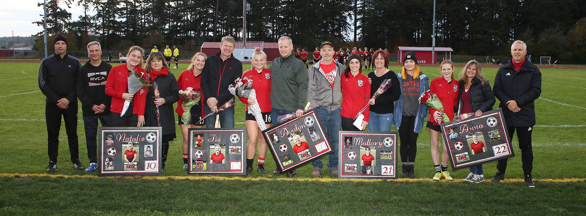 The Coupeville senior soccer players were honored at Wednesday’s final league match. (Photo by John Fisken)