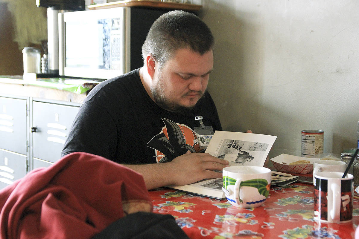 Photo by Laura Guido/Whidbey News-Times                                Gerhardt Hofstetter reads a book and sips black tea at Spin Cafe, which recently re-opened.