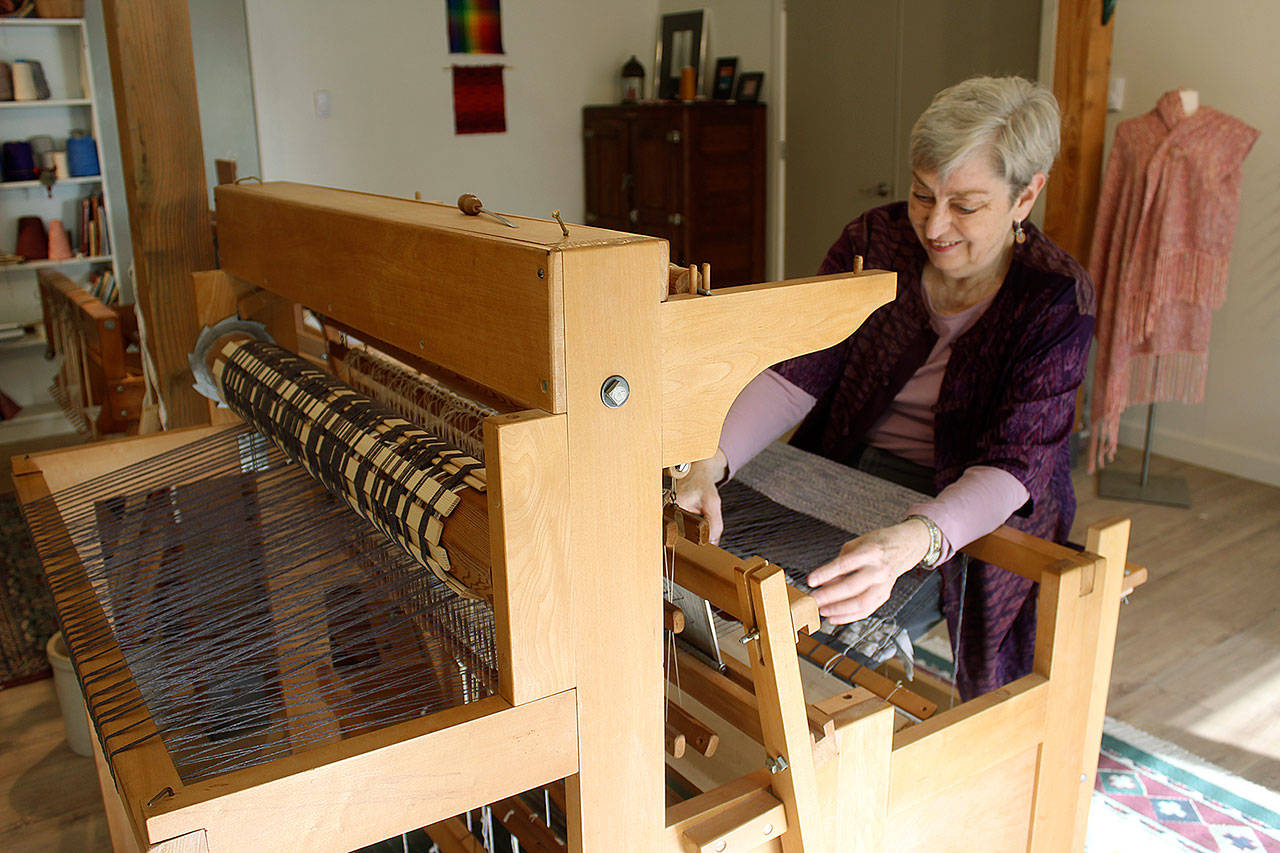 Whidbey Weavers Guild member Gretchen Schlomann works in her fiber-arts studio in Clinton. Photo by Wendy Leigh/Whidbey News Group