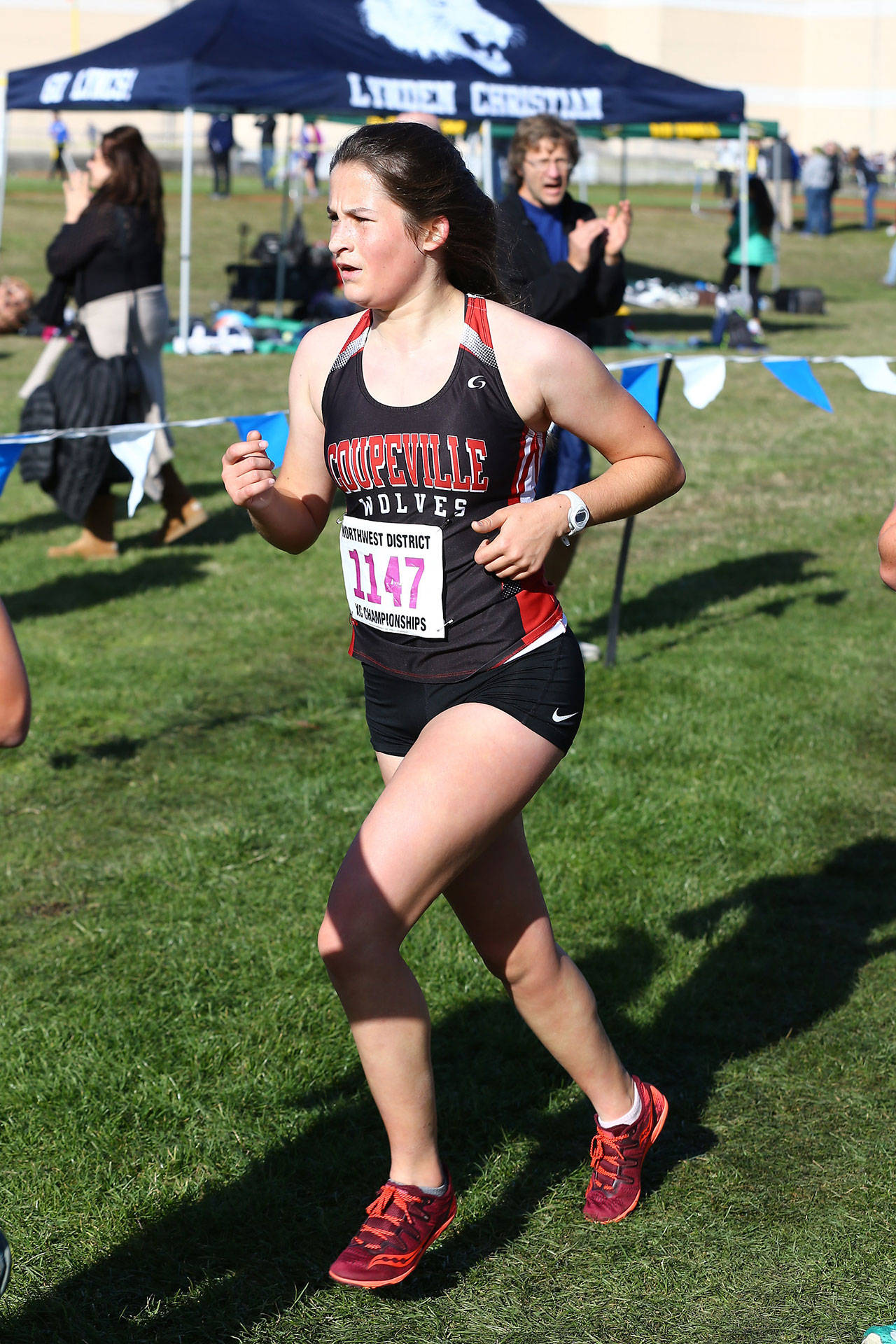 Coupeville’s Catherine Lhamon runs to 31st place and a berth in the state cross country meet.(Photo by John Fisken)