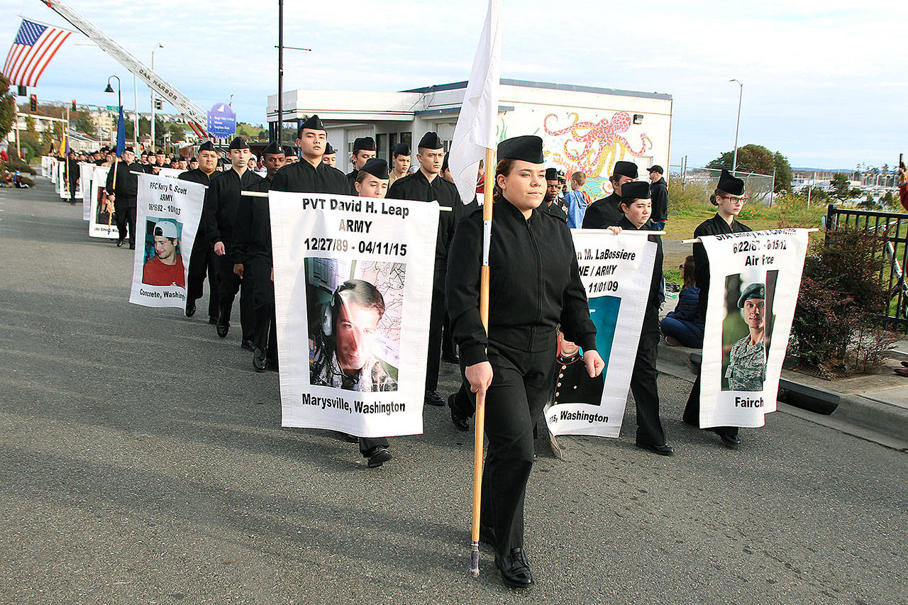 Oak Harbor High School Navy JROTC marches downtown Monday afternoon at the annual Veterans Day Parade.