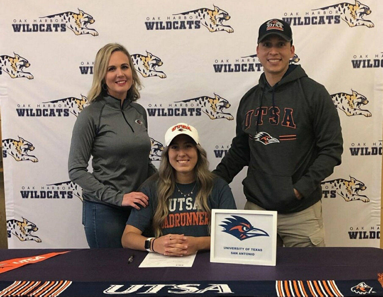 Mikhaela Cortez, flanked by her parents Niah and Lee, signed a letter of intent to play soccer for UTSA. (provided photo)
