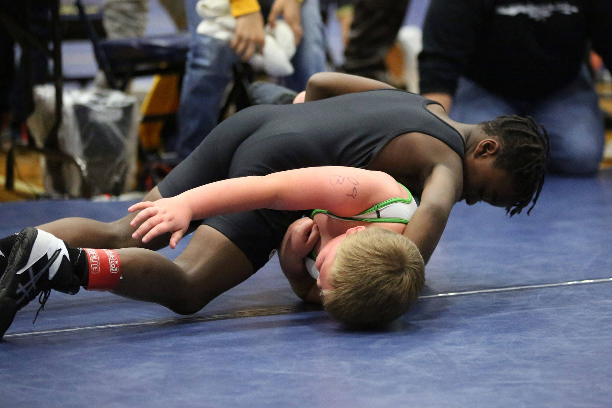 Oak Harbor Wrestling Club’s Jordan Wilson turns his opponent on the way to winning his weight division at the Yellowjacket Challenge last weekend. (Photo by John Fisken)