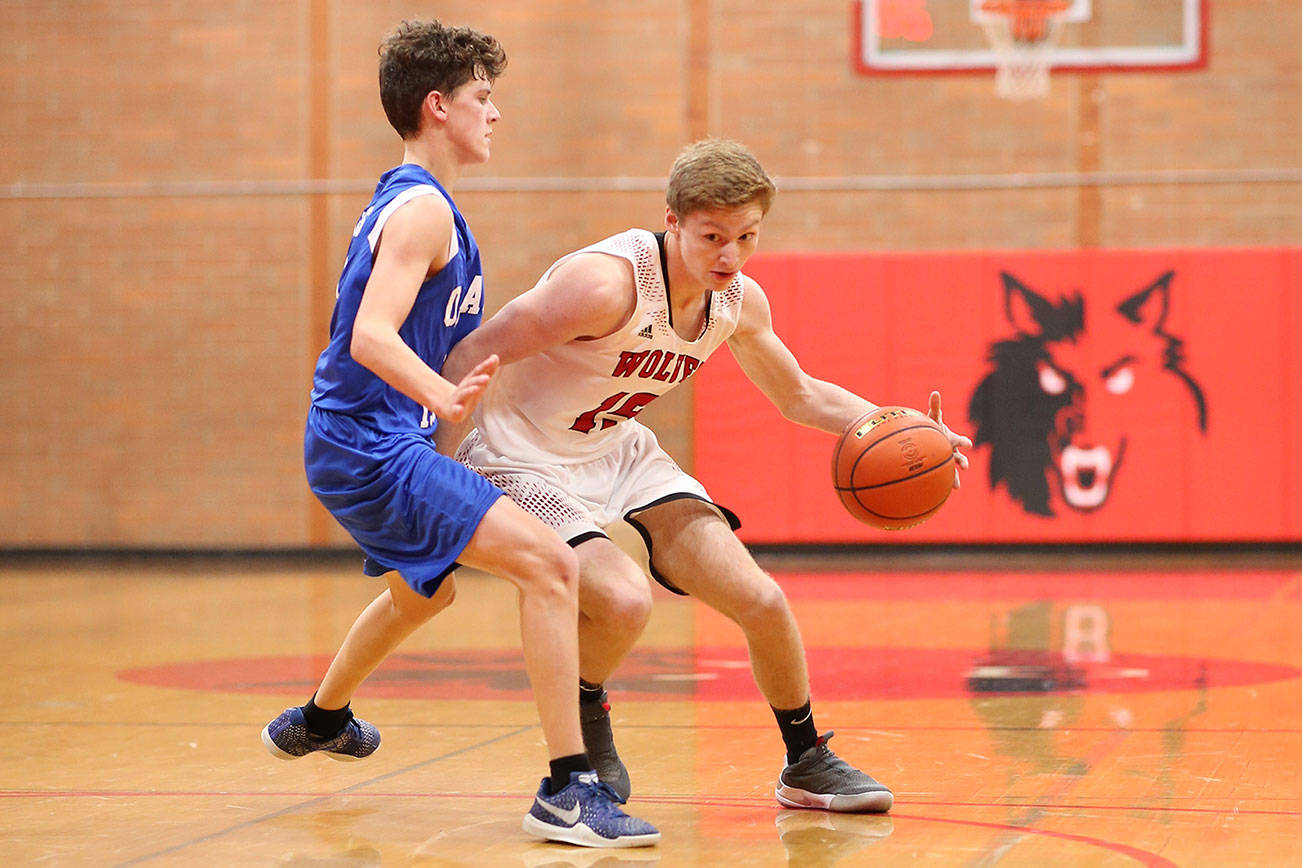 Wolves top Orcas Island, collect 1st win / Boys basketball