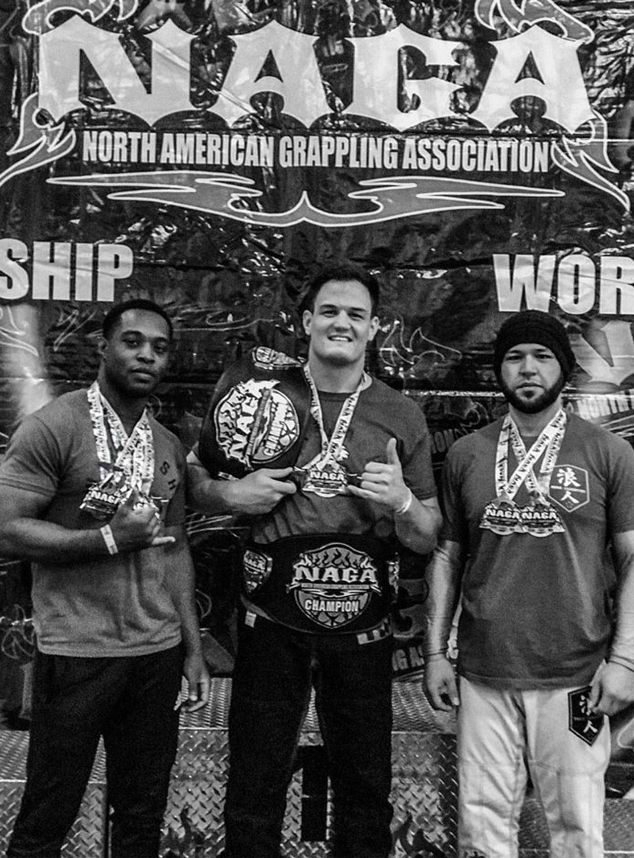 Miles Lewis, left, Steven McMahon and Jules VonDoom won world titles in jiu-jitsu earlier this month. (Submitted photo)
