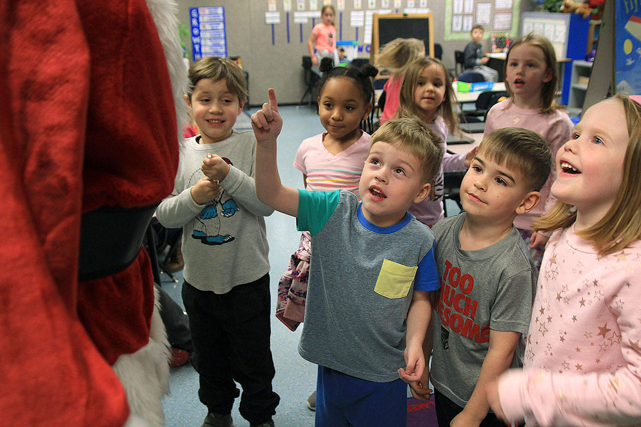 Santa Clause was greeted enthusiastically by kindergartners Sylas Tedder, Colten Yeiser, Sienna Hale, Henrik Glenday, Eliza Boland, Lauretta Hodges and Ensley Hodges. In the back: Emma Chappell and Ben Tower.