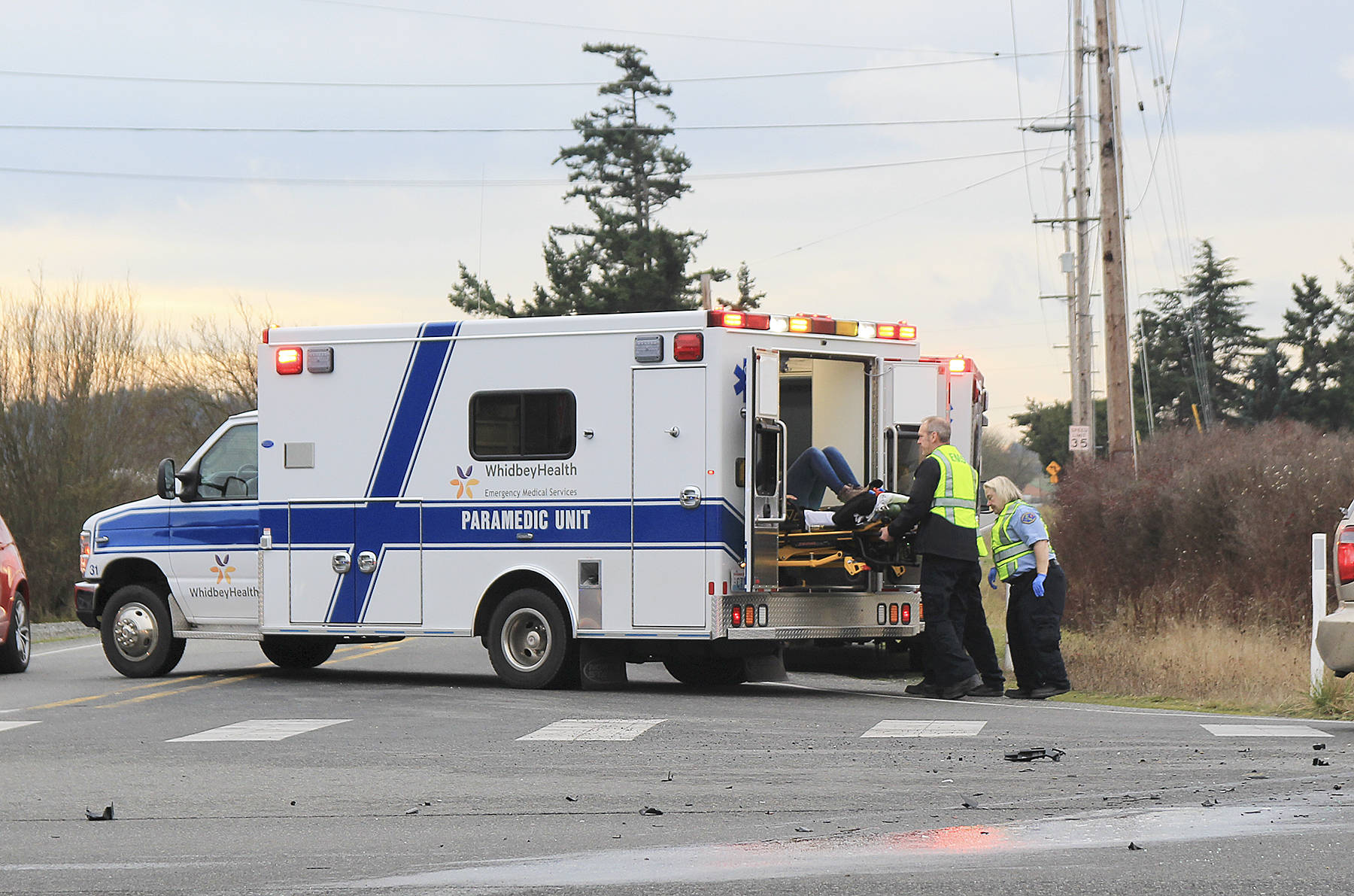 First responders transport someone from the scene of a three-car collision Thursday to WhidbeyHealth Medical Center. Photo by Laura Guido/Whidbey News-Times