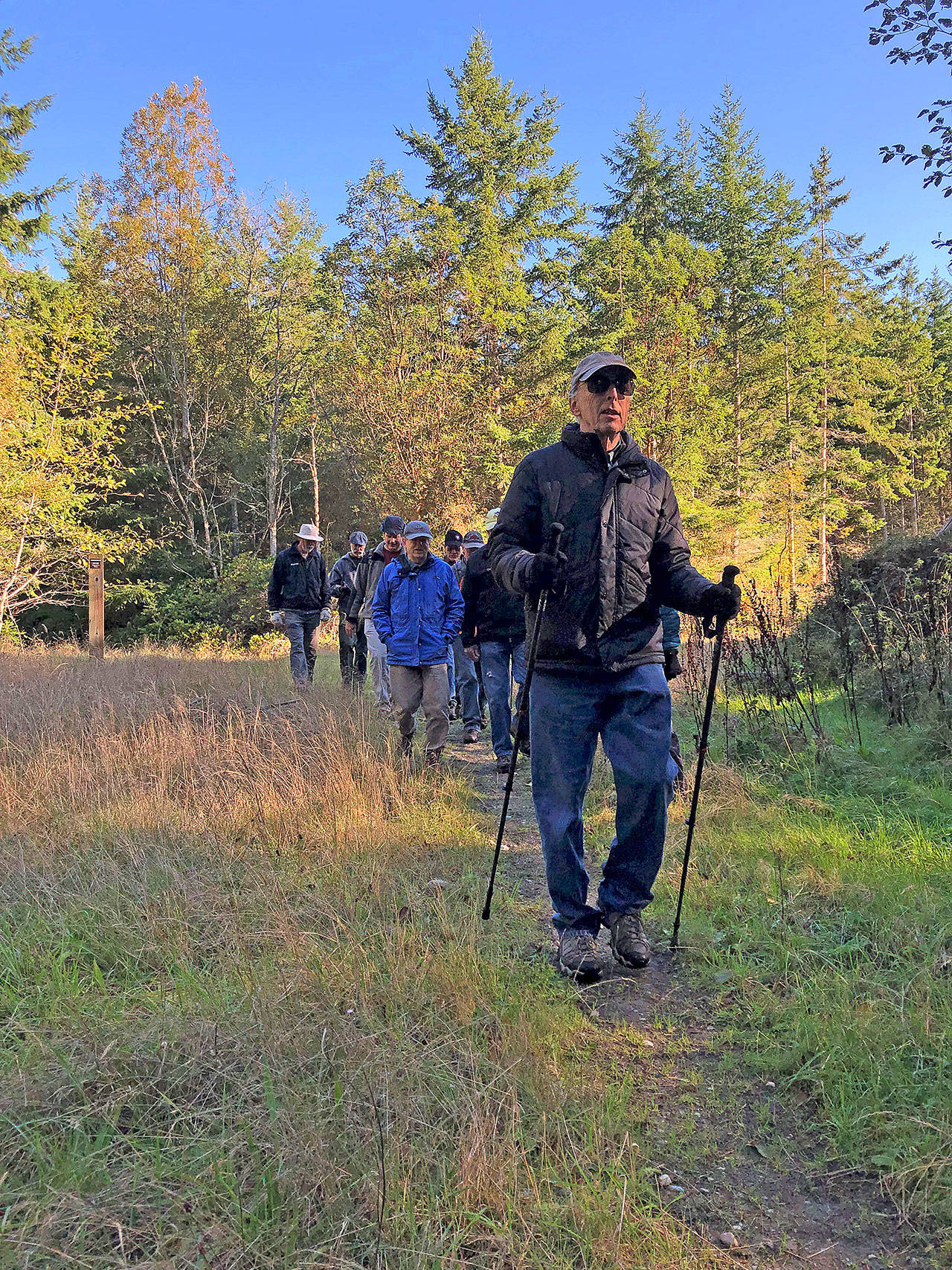 Photo courtesy of Whidbey Camano Land Trust                                Paul Goldfinger leads the Sons of the Beach on a hike in Trillium Community Forest last October.