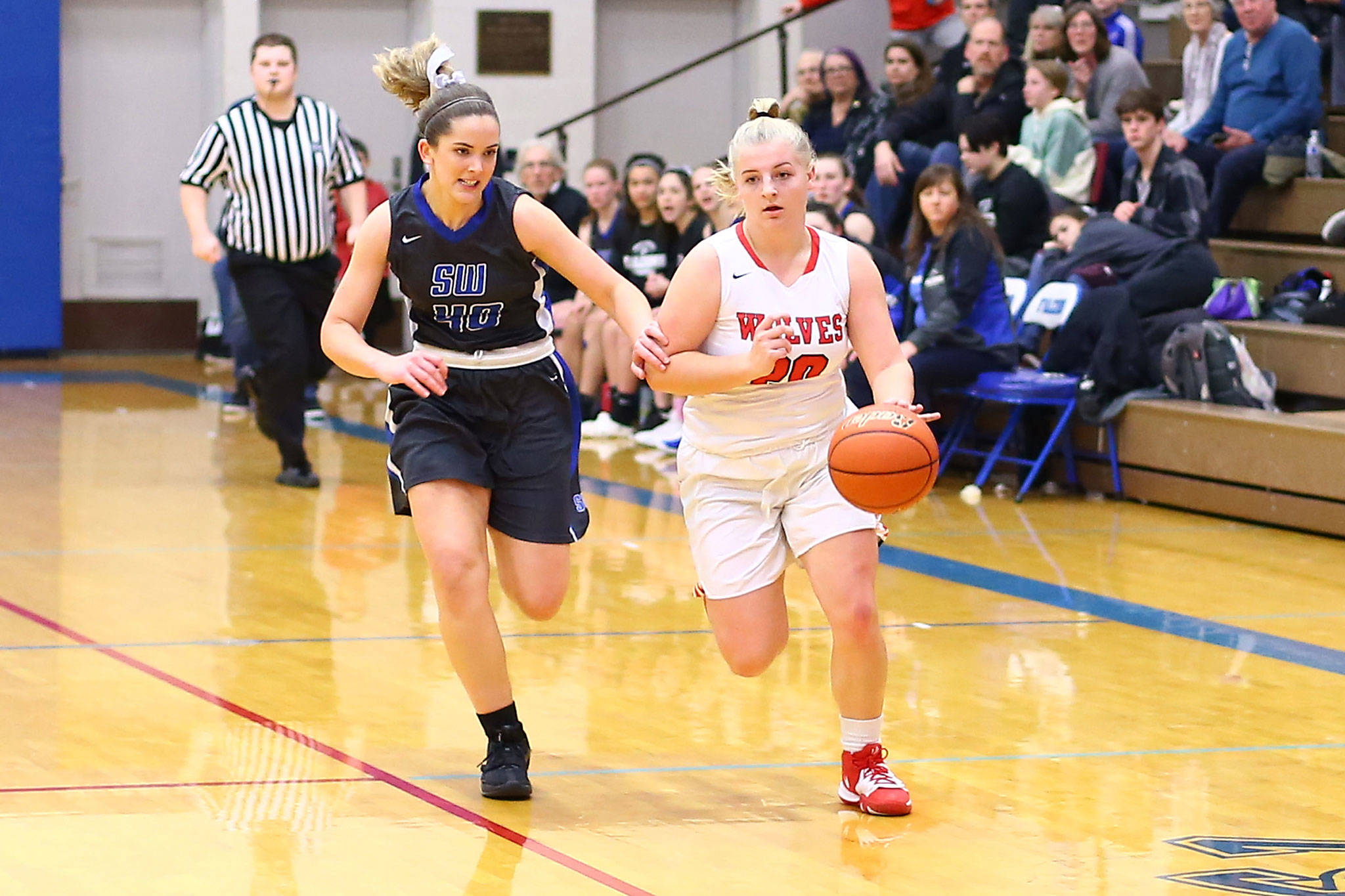 Coupeville’s Avalon Renninger, right, flies past South Whidbey’s Sami Daly in Friday’s game.(Photo by John Fisken)