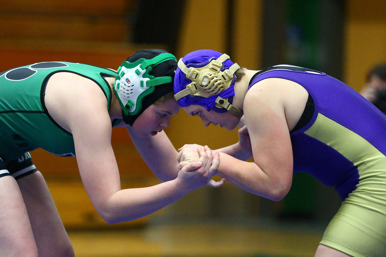 Oak Harbor’s Haven Lemme, right, tangles with Mount Vernon’s Aleigh Davis.(Photo by John Fisken)