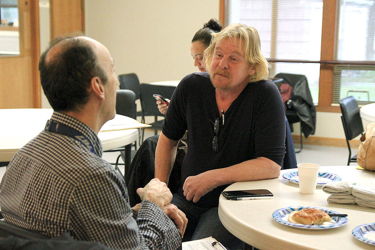 Photo by Laura Guido/Whidbey News-Times                                Todd Allen talks to social worker Dan Correll Thursday morning during the annual Point in Time count of homeless individuals.