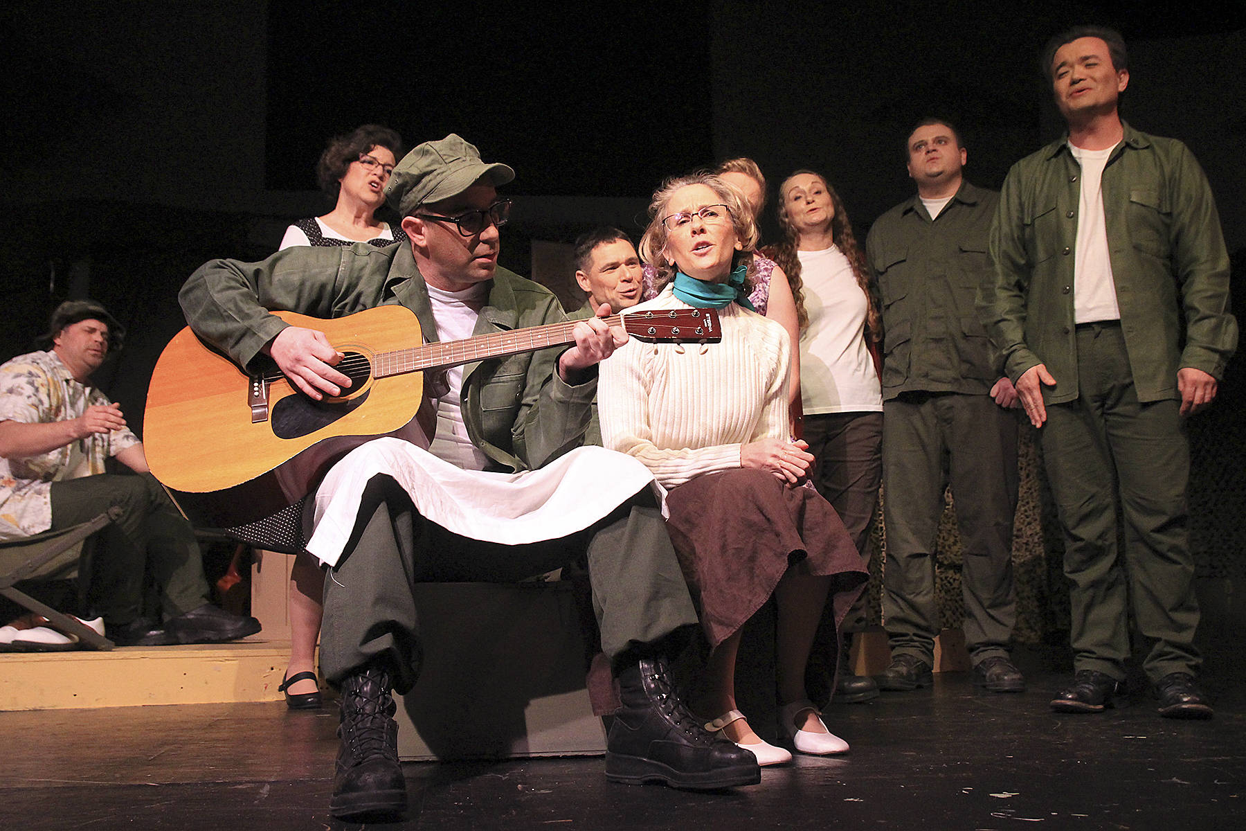 Pvt. Lopez and Lt. Louise Kimble, played by Jason Herken and Vicky Canales Riemer, perform a song that will be familiar to fans of the movie or TV show M*A*S*H during Whidbey Playhouse’s production of the play.