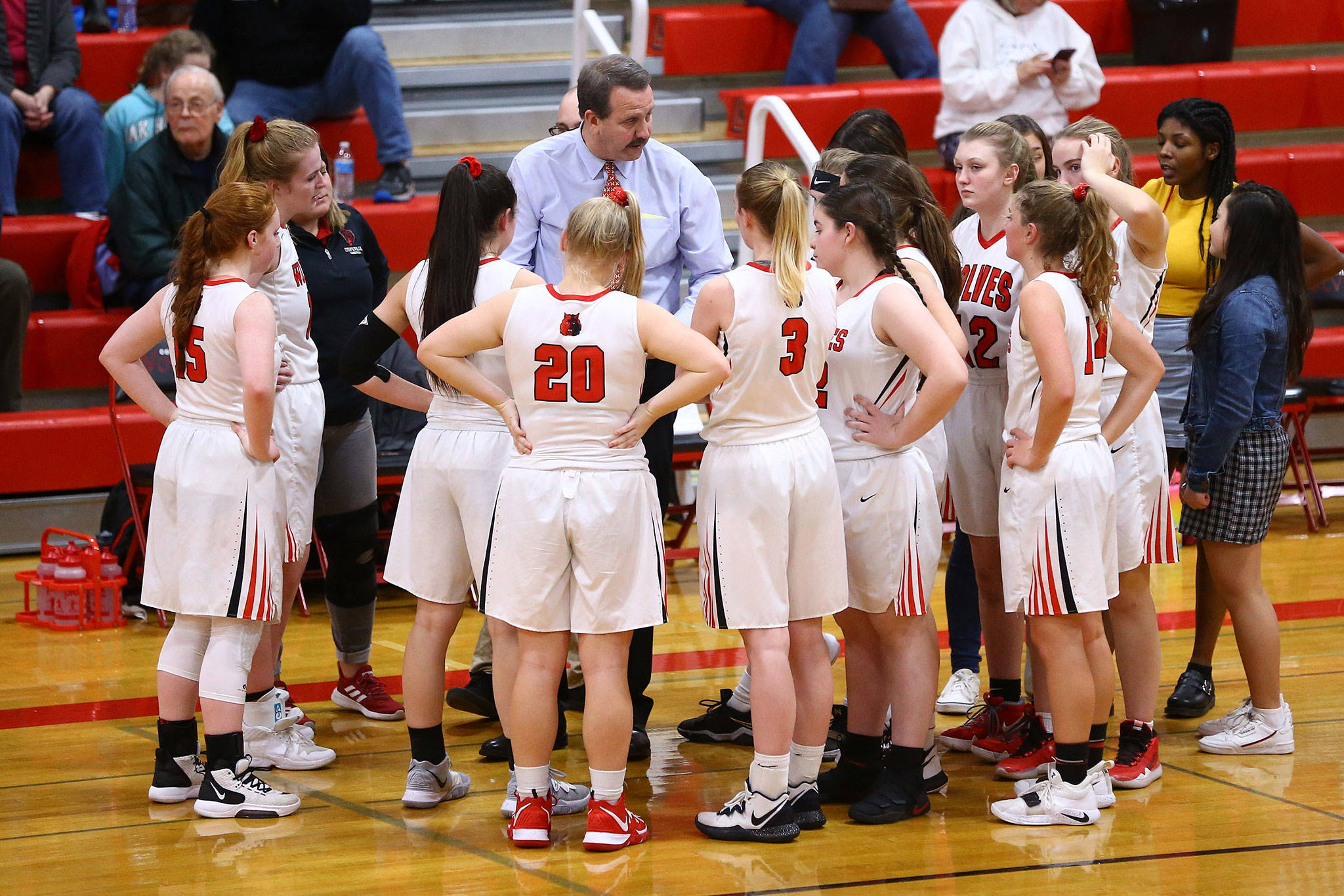 Coupeville coach Scott Fox addresses his team during a break in the South Whidbey game Tuesday.(Photo by John Fisken)