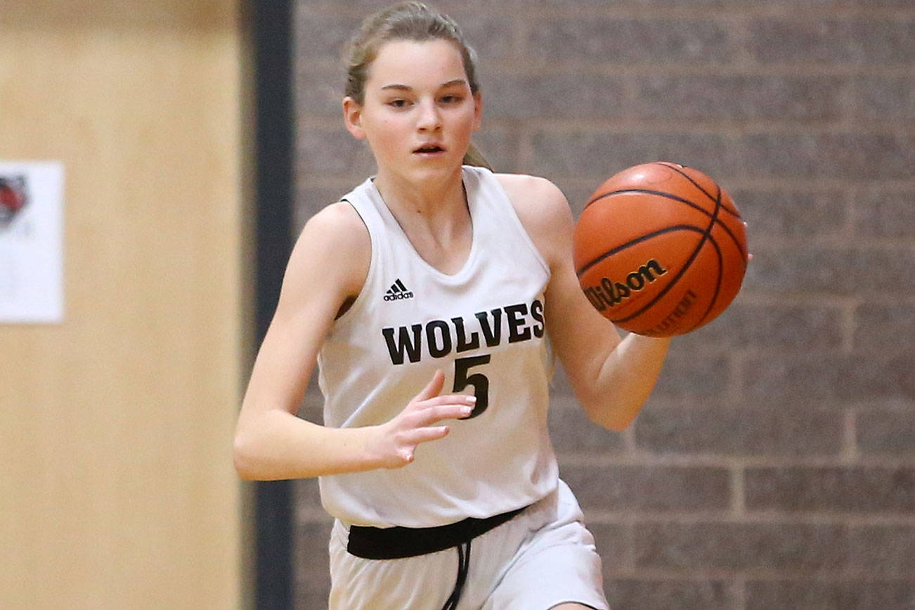 Photos: Wolves begin season with win / Middle school girls basketball