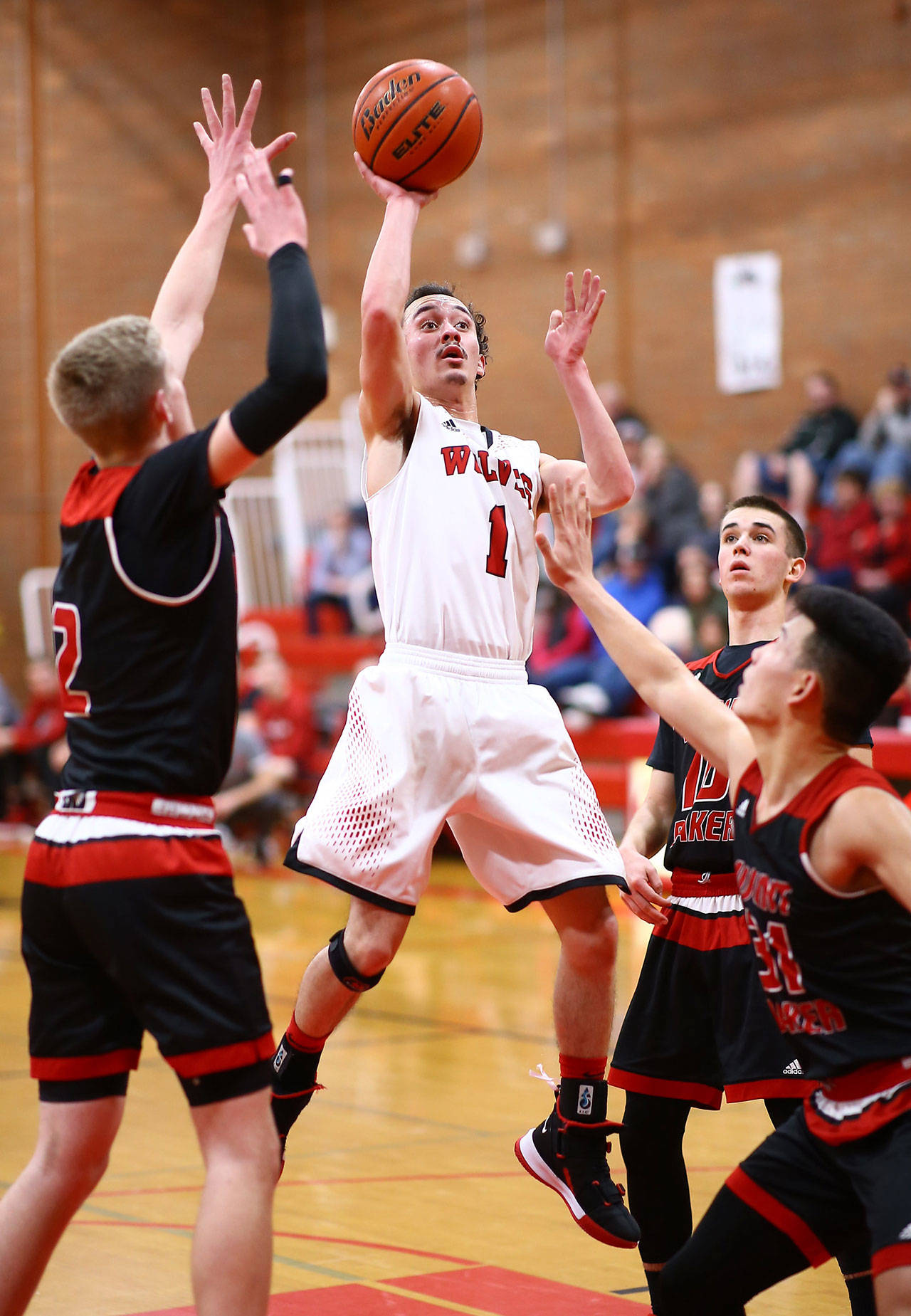 Jered Brown soars above the Mount Baker defense in Saturday’s play-in game. (Photo by John Fisken)