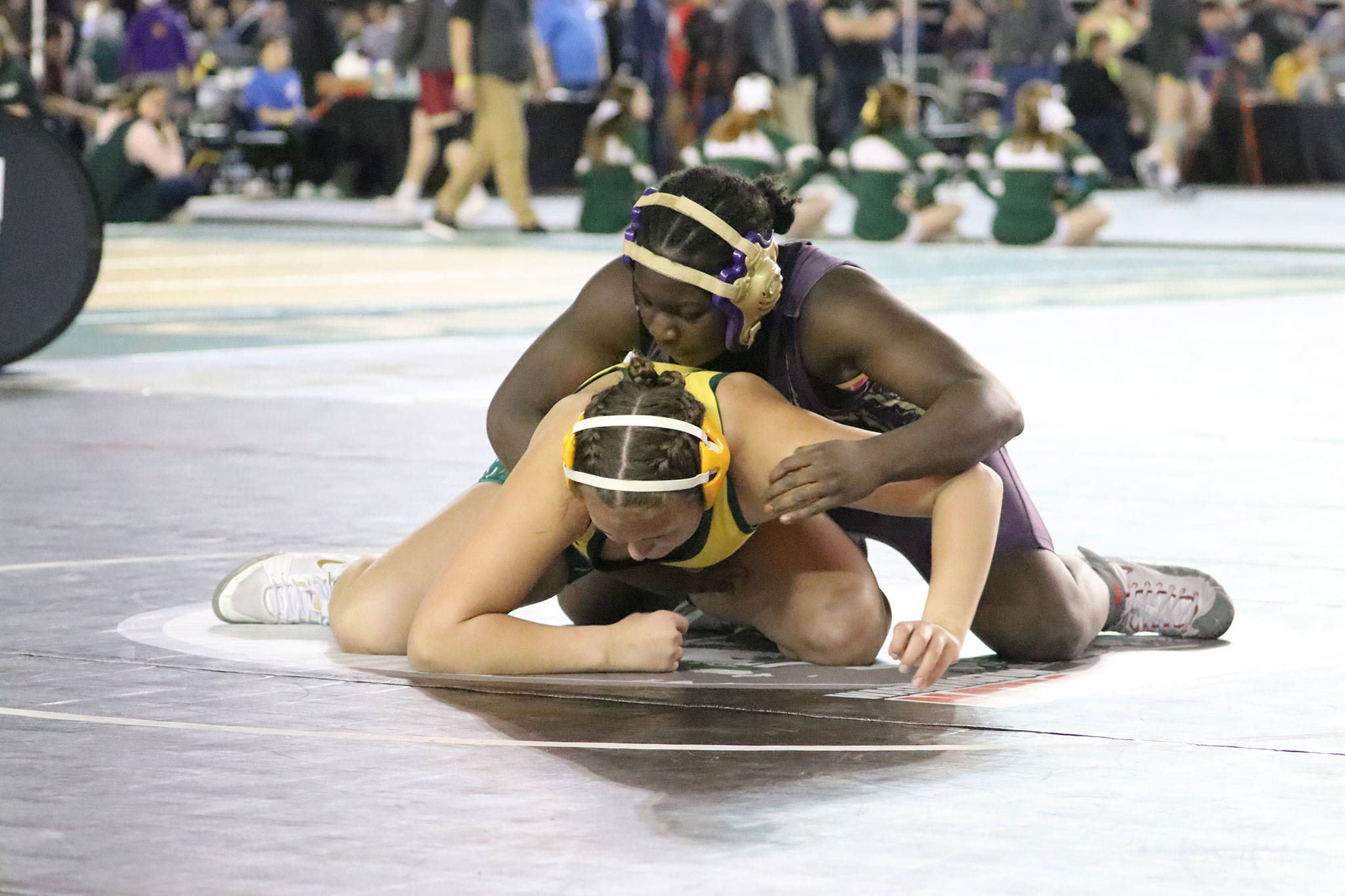 Oak Harbors Maria Dailey, top, tangles with Quinceys Shannon Workinger at the state tournament last weekend. (Photo by Sarah Manchester)