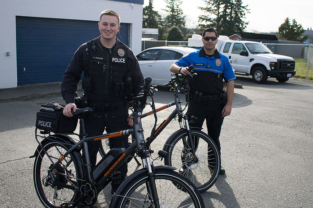 Photo by Brandon Taylor/Whidbey News-Times                                Officer Scott Johnson and School Resource Officer Jeremy Andreano will patrol Oak Harbor on electric bikes.