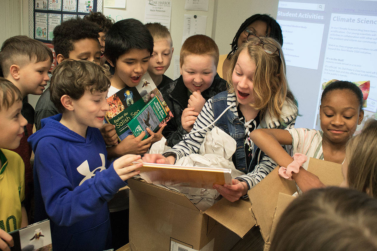 Photo by Brandon Taylor/Whidbey News-Times John Del Prete’s fourth-grade class finally sees their published book, “Invisible Pollution in the Salish Sea,” since beginning the project in September.