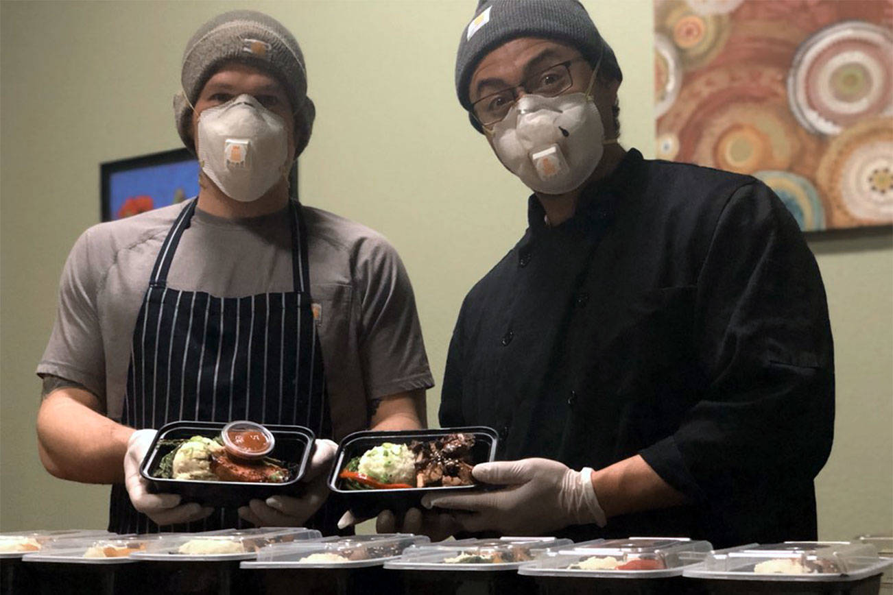 David Krolokouski and Juan Zalapa, right, prepare meals every Sunday in the kitchen of Pickles Deli in Clinton.