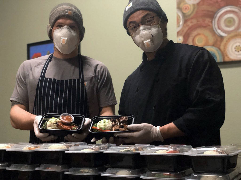 David Krolokouski and Juan Zalapa, right, prepare meals every Sunday in the kitchen of Pickles Deli in Clinton.