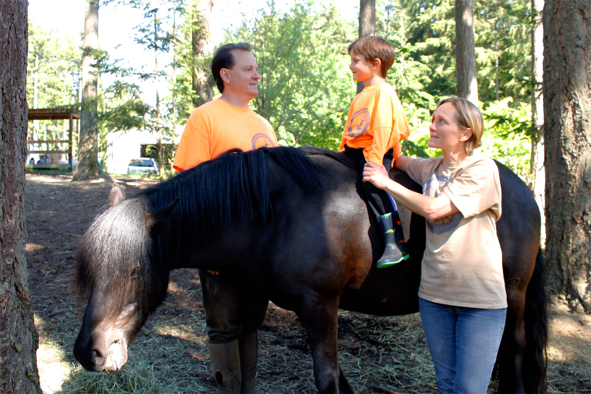 Photos by Kira Erickson/Whidbey News-Times                                The Cerrato family with Arabella, a rare full-grown Dales pony. From left to right, George, Viggo and Shuna.