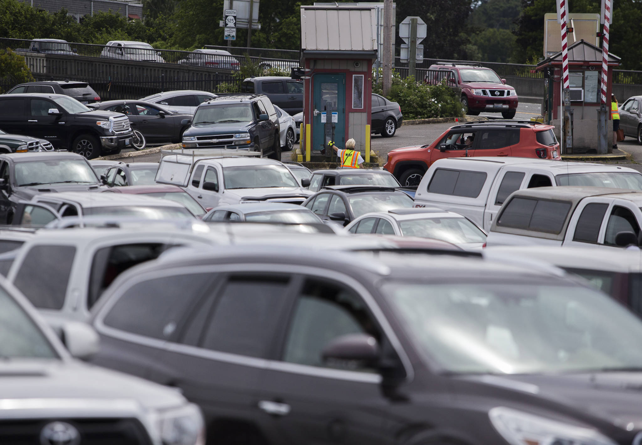 Photo by Olivia Vanni/Herald file                                Cars full of passengers headed to Whidbey Island pull into the ferry lines in Mukilteo on June 26.