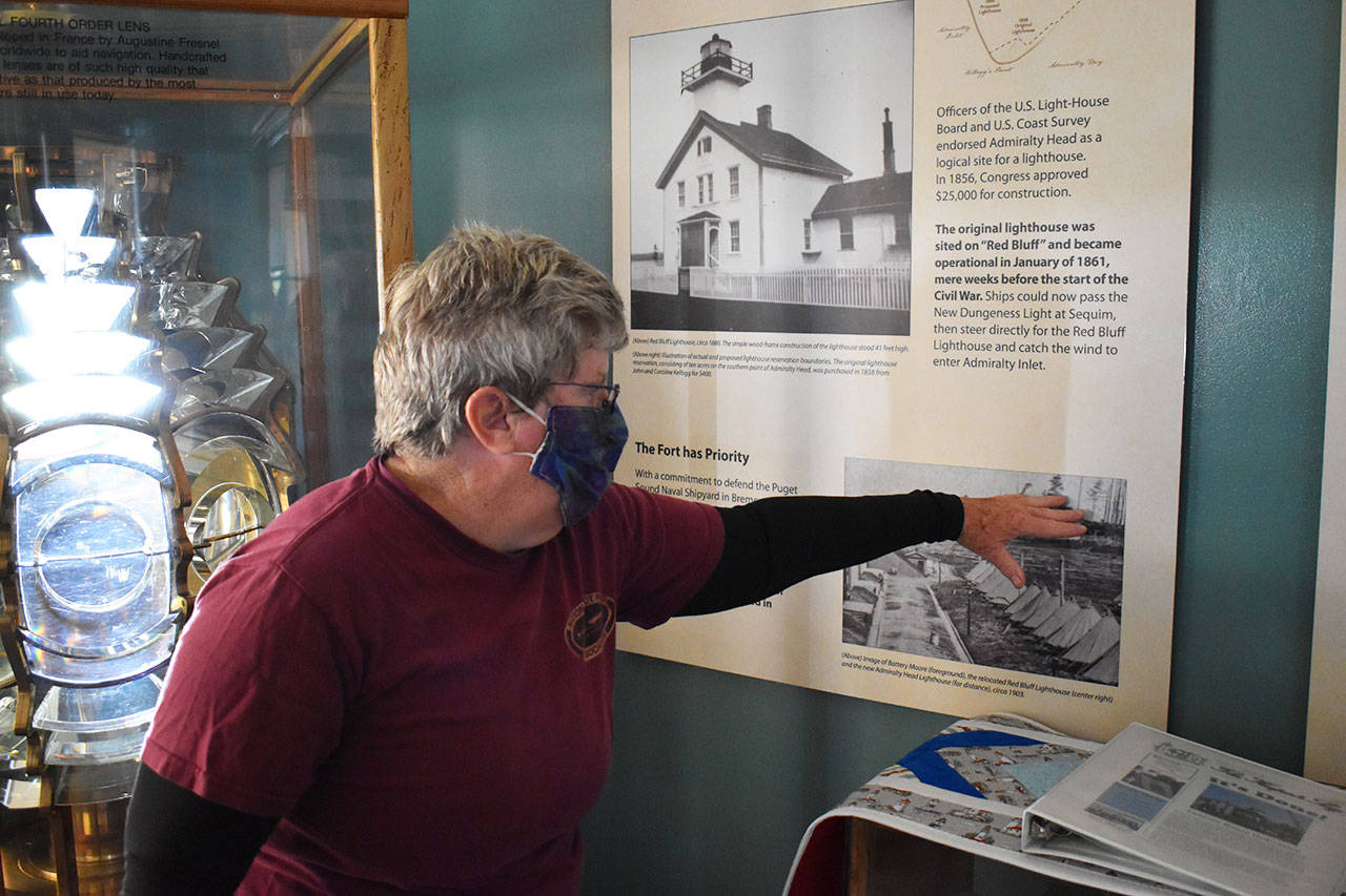 Cheri Anderson knows every nook and cranny of Admiralty Head Lighthouse and enjoys sharing the structure’s 117-year-old history with visitors. Photo by Emily Gilbert/Whidbey News-Times.                                Cheri Anderson knows every nook and cranny of Admiralty Head Lighthouse and enjoys sharing the structure’s 117-year-old history with visitors. Photo by Emily Gilbert/Whidbey News-Times.