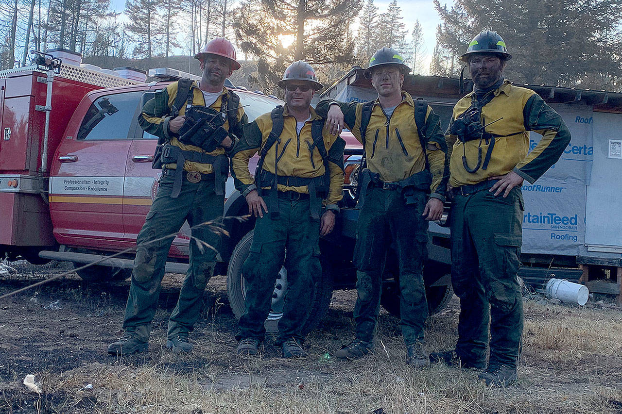 (Left to right) Capt. Jerry Helm, Jeff Patton, Dalton Martin and Kole Kellison of Central Whidbey Fire & Rescue battled flames at the Palmer Fire in eastern Washington for a week. Photo by Jerry Helm.
