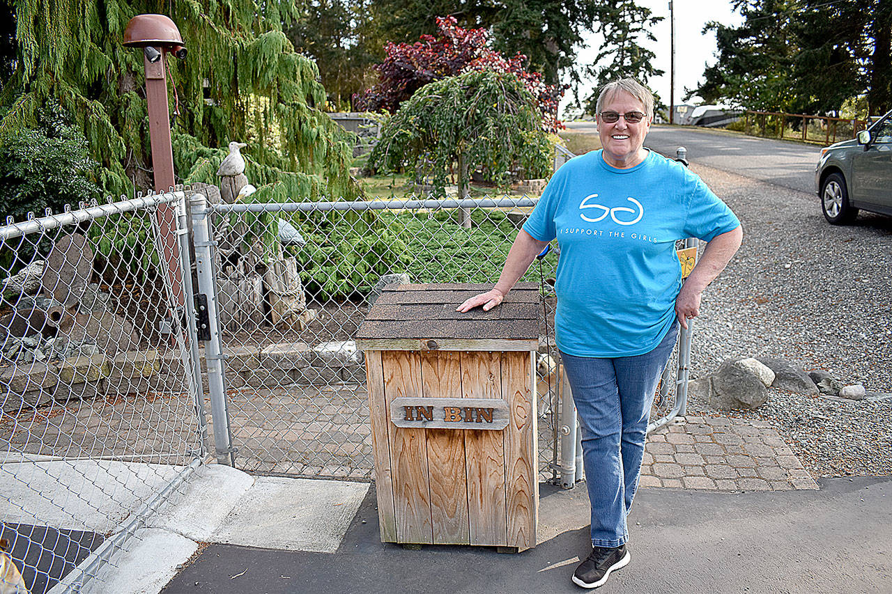 Kate Mistler stands with I Support The Girls donation box outside of her home at 1008 Diane Ave. in Oak Harbor.