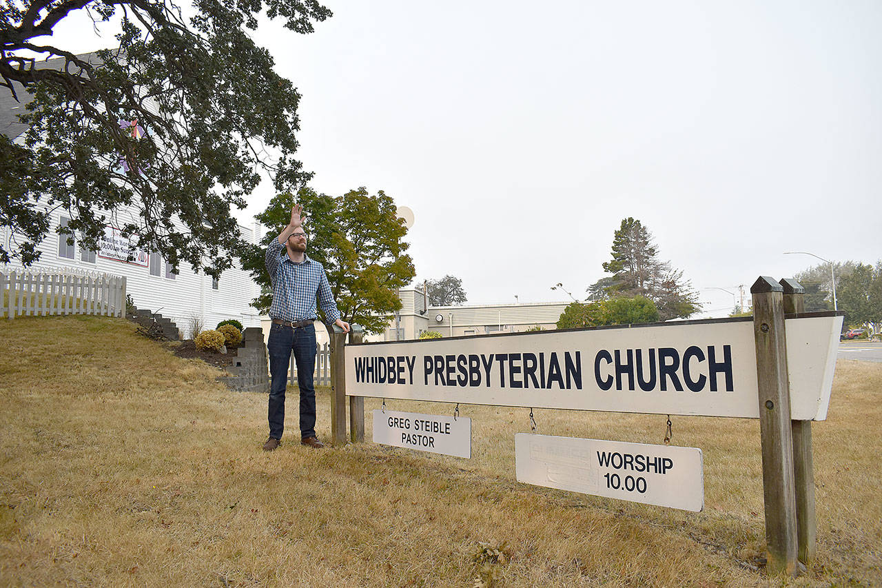 Drivers honk at Whidbey Presbyterian Church’s new pastor, Greg Steible, before he gave his first sermon. Photo by Emily Gilbert/Whidbey News-Times