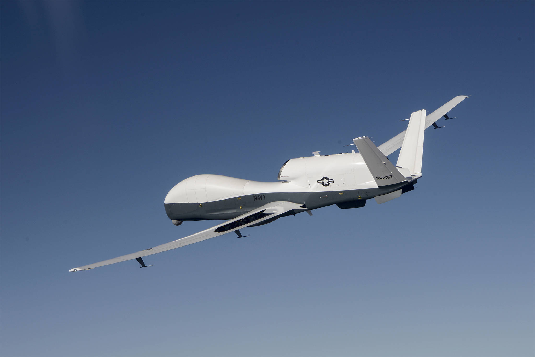 The MQ-4C Triton unmanned aircraft system flies over Edwards Air Force Base, Calif., during a flight test activity in June. Though the Northrop Grumman aircraft won’t be landing at Naval Air Station Whidbey Island, Capt. Matt Arny said its mission will be run from the base. Photo by Alan Radecki.