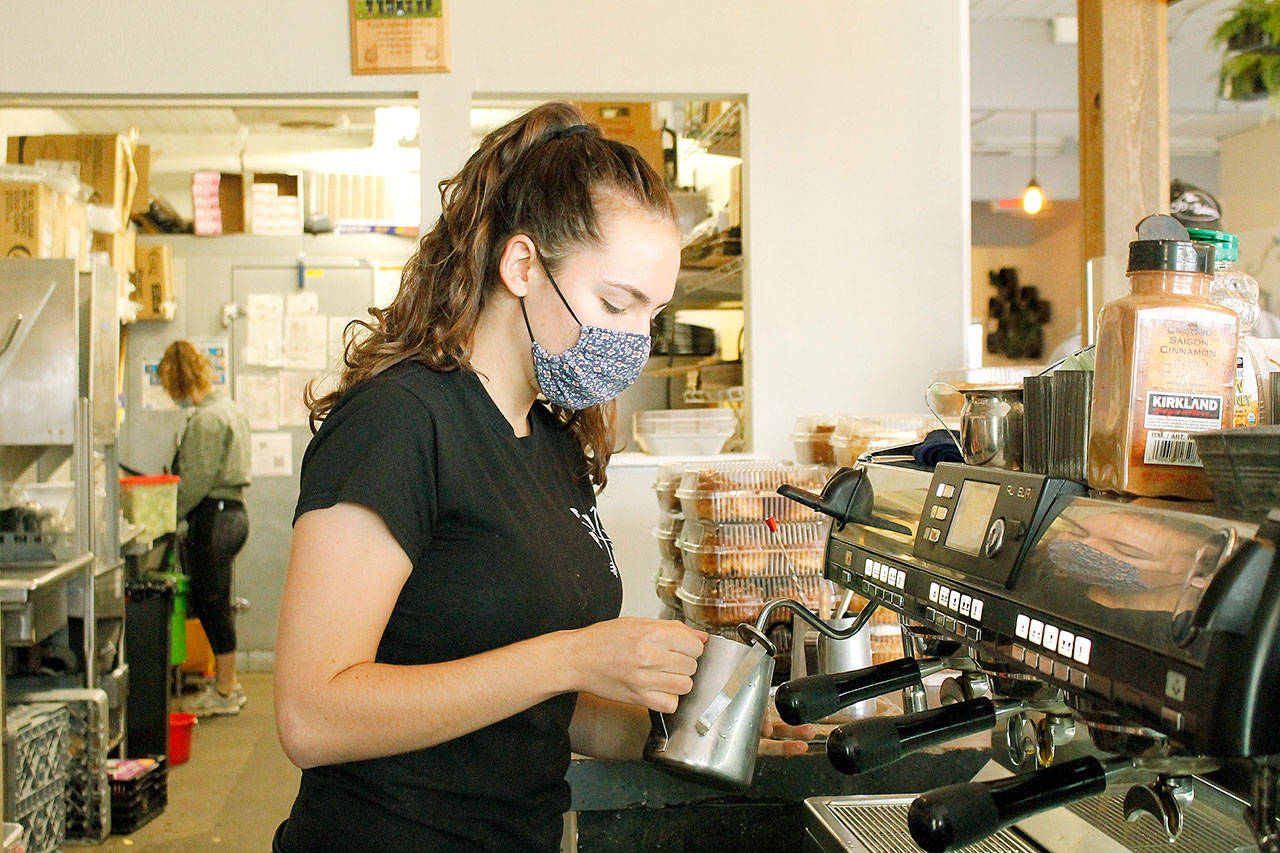 Photo by Kira Erickson/Whidbey News Group
Annalise Litchard, a barista at Rock Island Coffee, prepares a latte for a customer. The Oak Harbor coffee shop is closing on Halloween. Staff will be relocating to Sunshine Drip in Coupeville, Rock Island’s sister store.