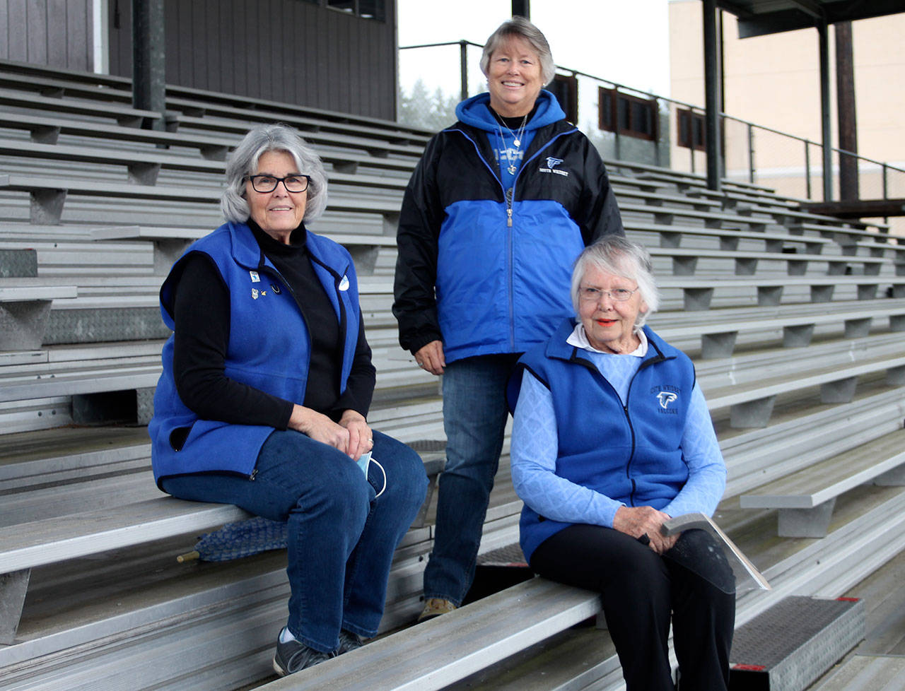 For decades, Pat Nostrand, left, Janet McNeely and Mary Ann Davis have helped behind the scenes at South Whidbey High School sporting events. (Photo by Jim Waller/Whidbey News Group)