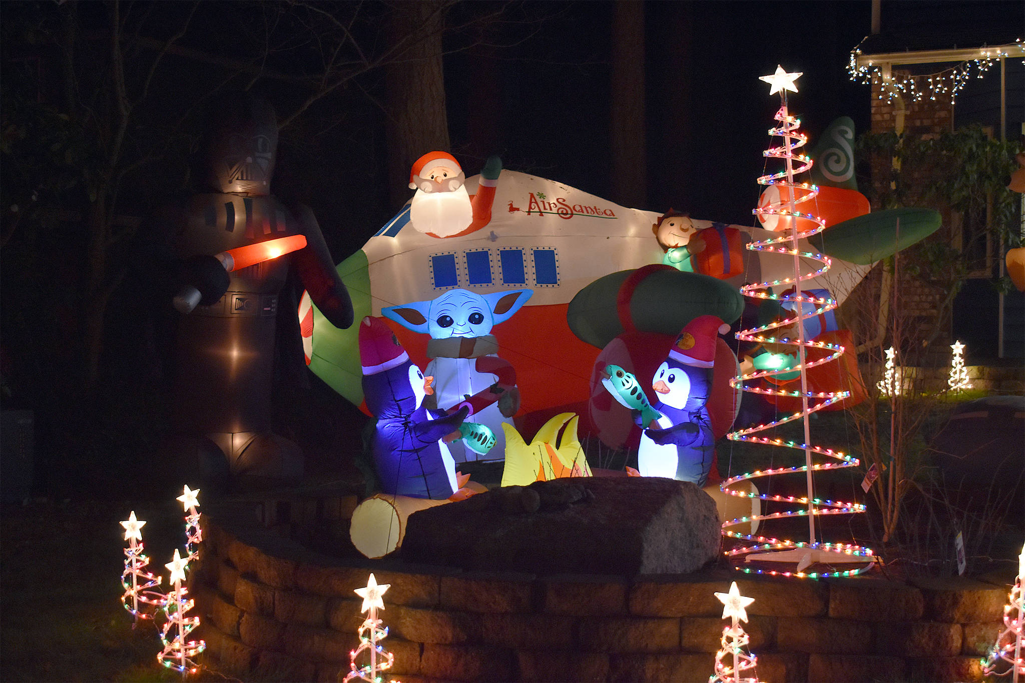 An unexpected pairing of Baby Yoda and Santa in a jet plane are the stars of this home’s Christmas display, located just off of Southwest Swantown Avenue in Oak Harbor. Photo by Emily Gilbert/Whidbey News-Times