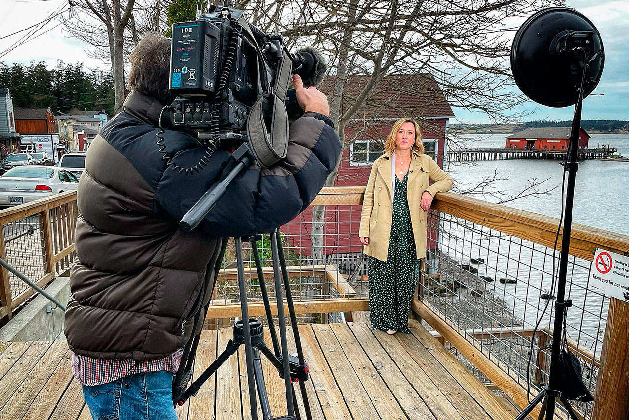 A KING-5 camera crew tapes an interview with Aaron Wiley after her business, Seaside Spa and Salon, was awarded a Puget Sound Energy small business makeover. Photo submitted
