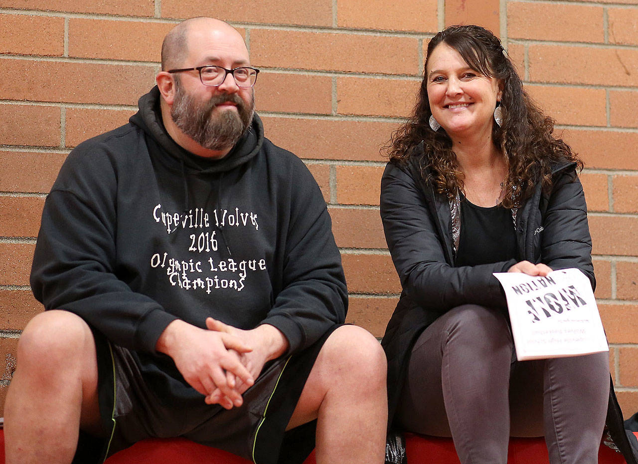 David Svien, left, and Coupeville parent Sherry Roberts take in a high school basketball game. (Photo by John Fisken)