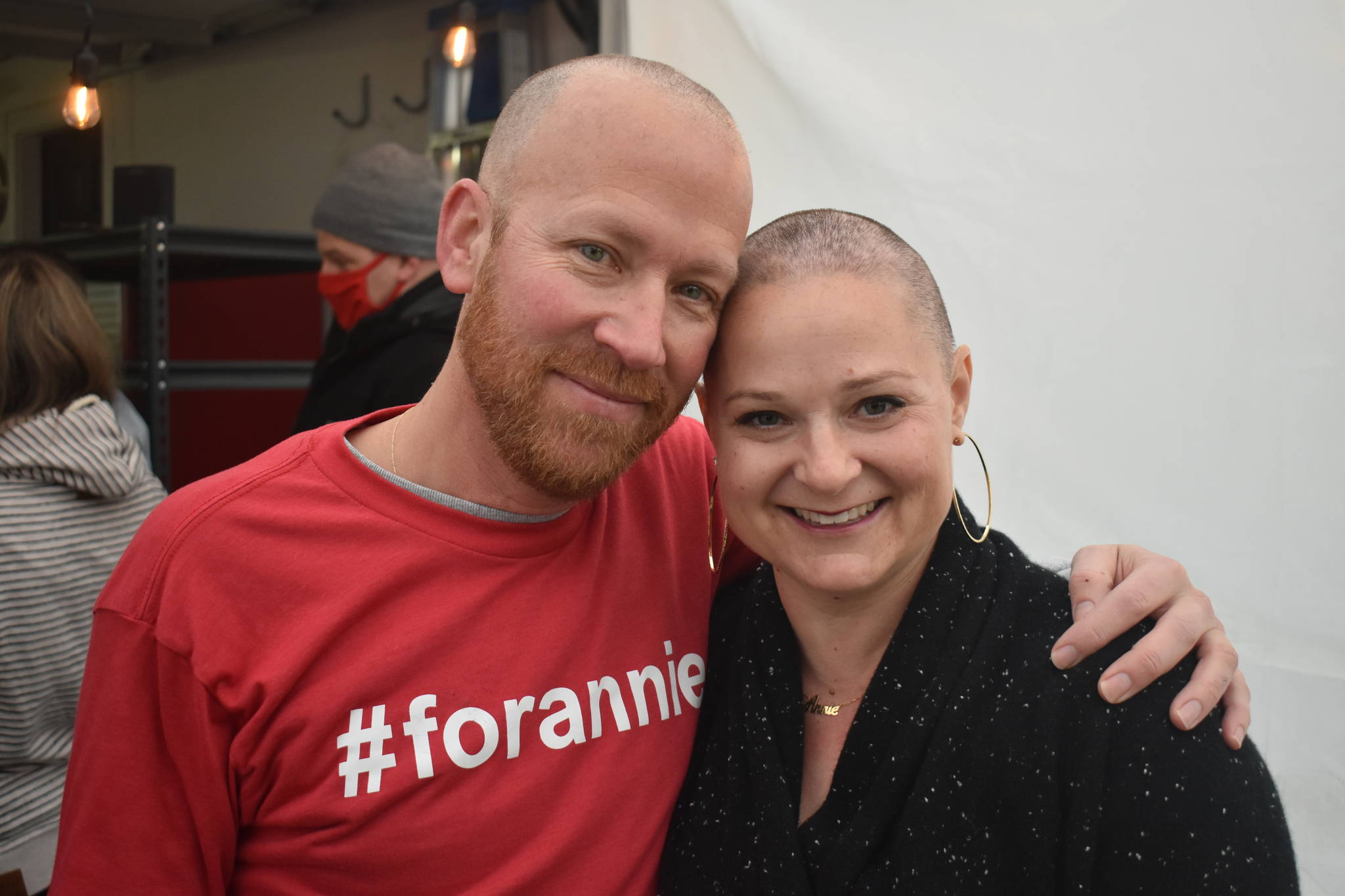 Jason McFadyen, left, organized about a dozen friends to shave their heads in support of Annie Cash as she goes through breast cancer treatment. Cash was voted top real estate agent, business person and community leader in the Whidbey News-Times Best of Whidbey 2020 contest. Photos by Emily Gilbert/Whidbey News-Times