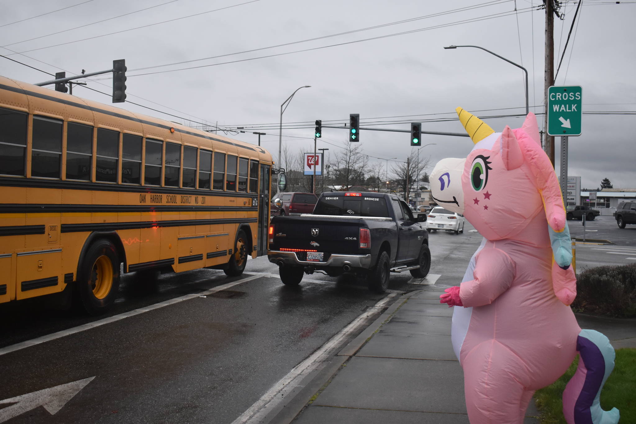 The woman inside the unicorn suit says she dons the outfit just to bring people a smile. Photo by Emily Gilbert/Whidbey News-Times