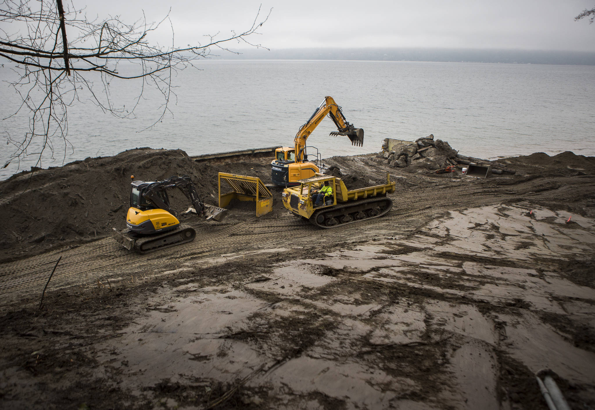 Photo by Olivia Vanni / The Everett Herald
Dirt is sorted for debris and large rocks during the deconstruction of a seawall north of Langley.