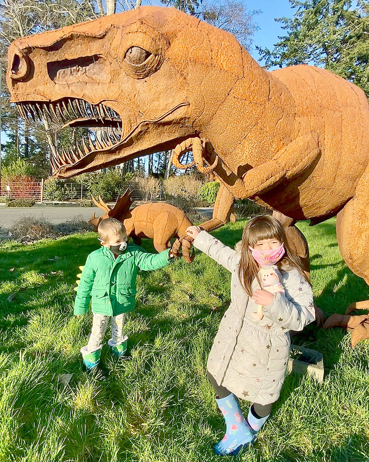 At left, Leo Zucca, 4, of Everett visits the yard of grandma Mary Saltwick in Freeland on Whidbey Island. He’s seen here with Momo Brown, 5, the reporter’s granddaughter. (Andrea Brown / The Herald)