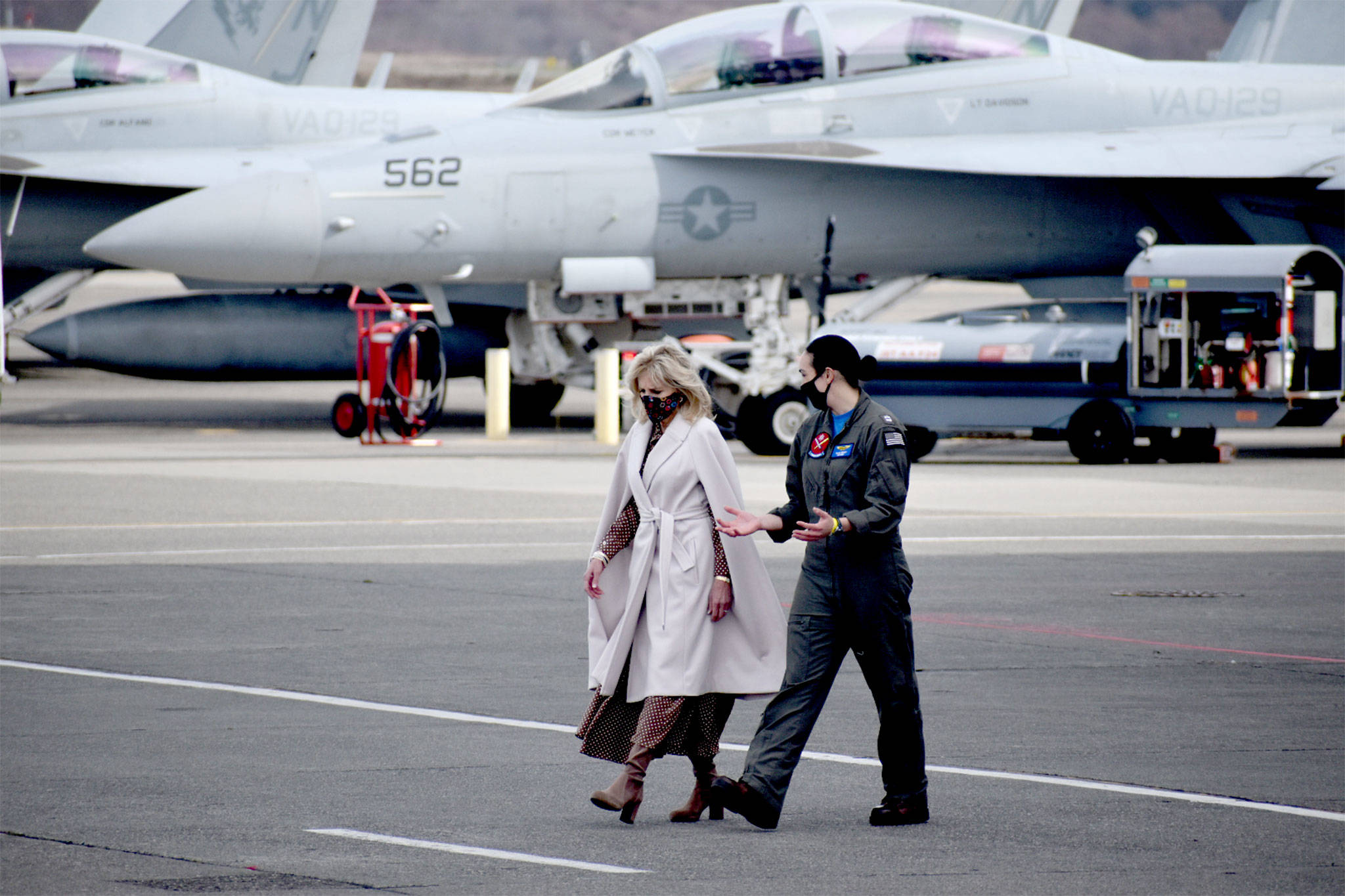 After a closeup look at an EA-18G, Dr. Jill Biden, left, talks with Lt. Cate Oakley, a Growler pilot at Naval Air Station Whidbey Island. The first lady visited the base Tuesday to meet with military families to listen to their concerns. Photo by Emily Gilbert/Whidbey News-Times