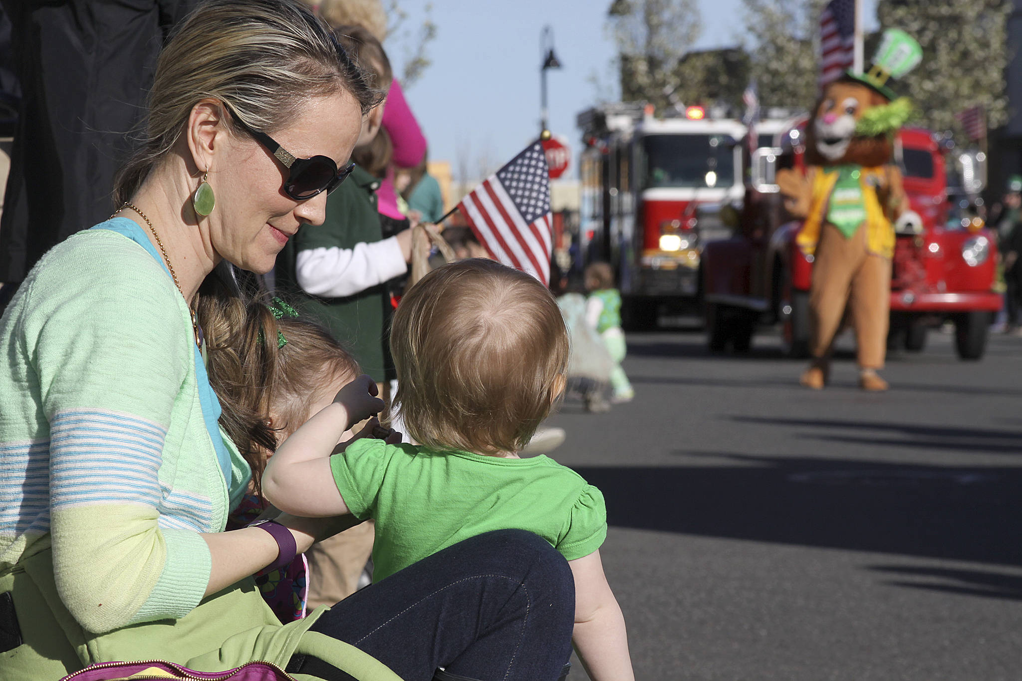 Families like the one above won’t line the streets of Oak Harbor this year for a St. of Patrick’s Day Parade. This is one of the events canceled so far this year because of the pandemic. File photo/Whidbey News-Times