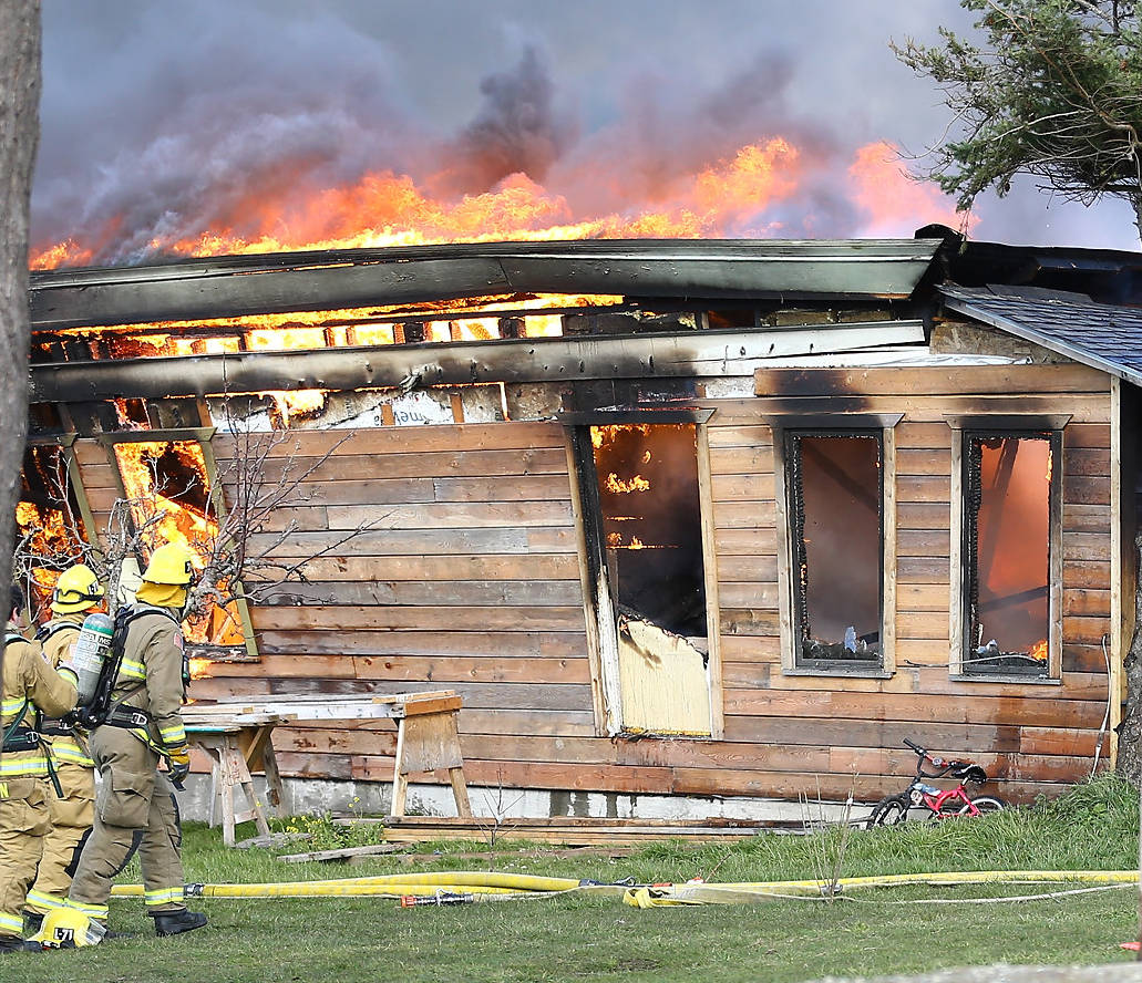 Multiple agencies responded to a house fire on Swantown Road in Oak Harbor Friday morning. North Whidbey Fire and Rescue Chief John Clark said the cause is still under investigation, but did not appear to be suspicious. Photo by John Fisken
