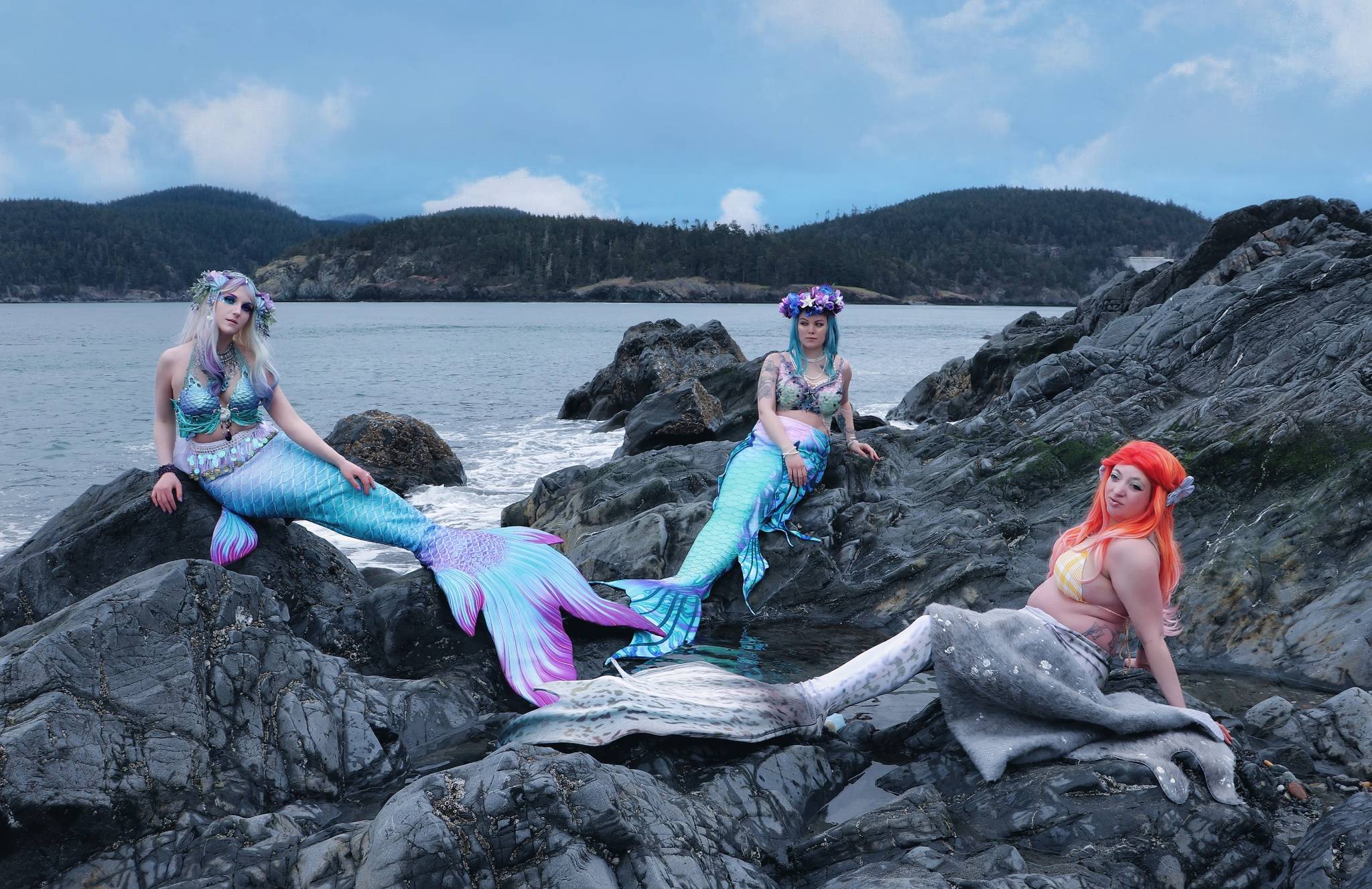 Photo provided
Stella Rowan, left, Savannah Mounce and Luna Grove, right, get together for swims and photoshoots like this one at Deception Pass State Park. The trio of two mermaids and a self-described “heavy metal selkie” call themselves the Whidbey Island Sirens.