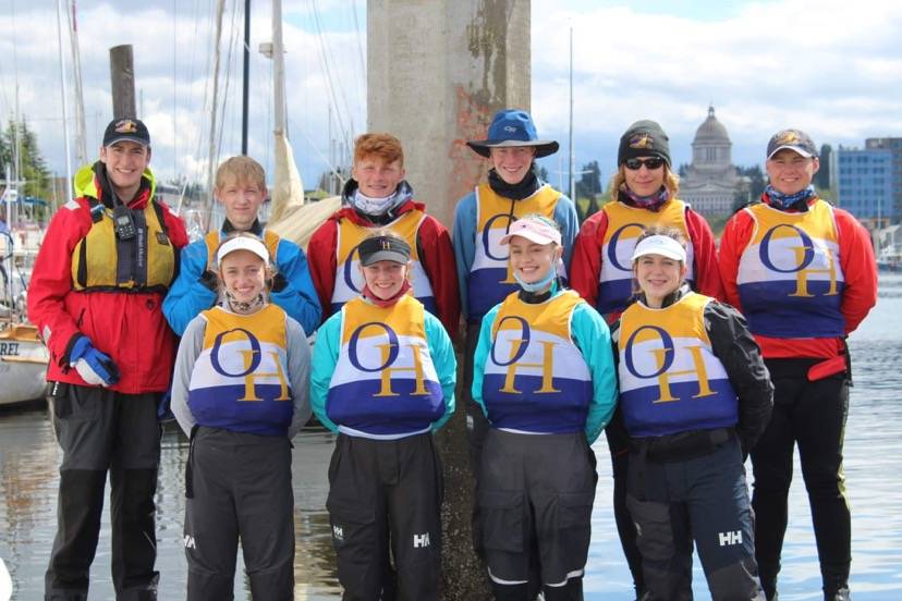 Members of the Oak Harbor High School Sailing team are, from left to right: Top row, coach Shawn O’Connor, Liam Chapman (‘22), Ryan Metz (‘22), Ben Servatius (‘22), Thomas Buys (‘22), Andrew Buys (‘21). Bottom row, Emelia Boilek (‘22), Anna Servatius (‘24), Allison Bailey (‘23), Shelby Lang (‘23). Photo by Denise Buys