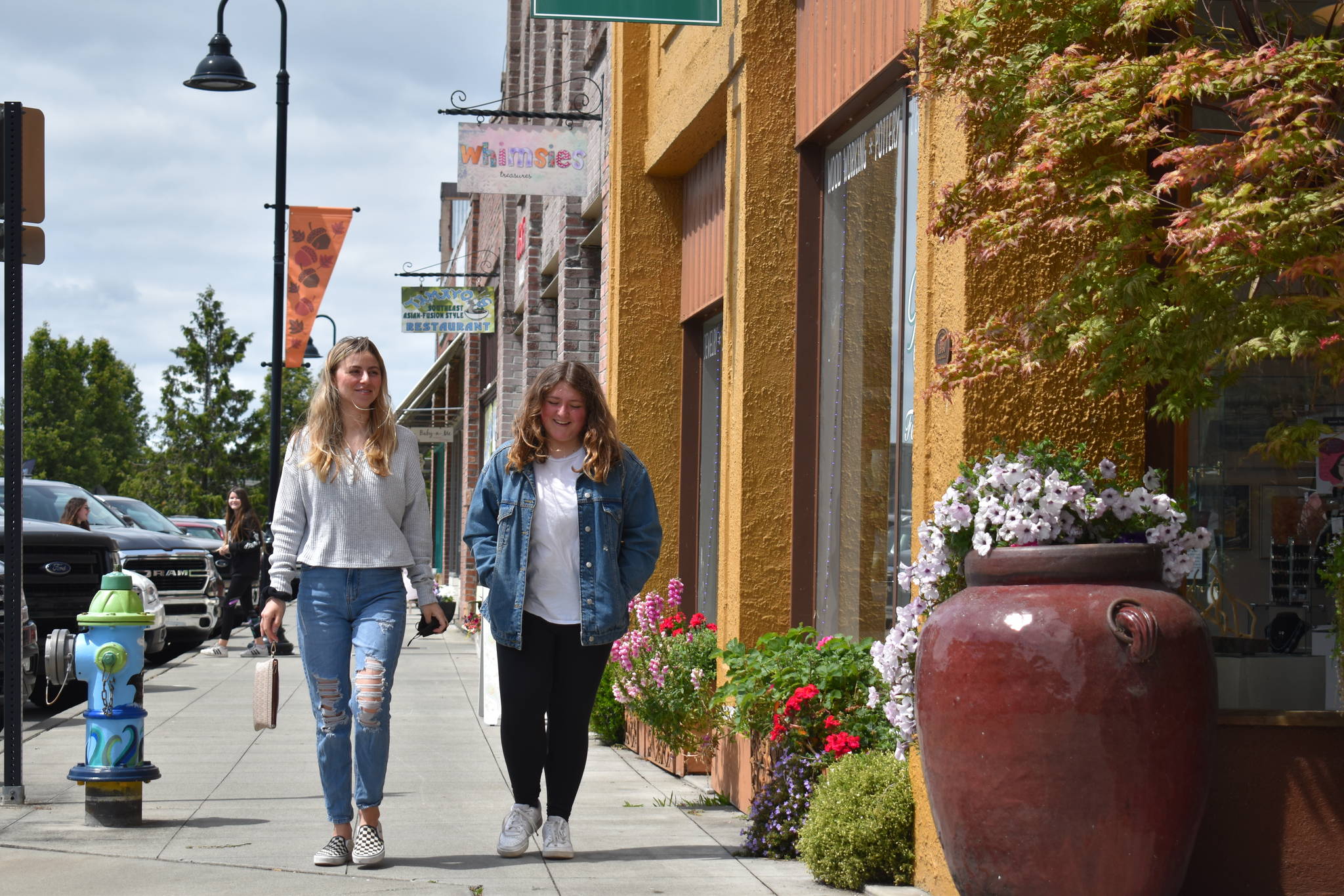 Katie McGowan, left, and Ava Lang, right, walking to lunch in downtown Oak Harbor. (Photo by Emily Gilbert/Whidbey News-Times)
