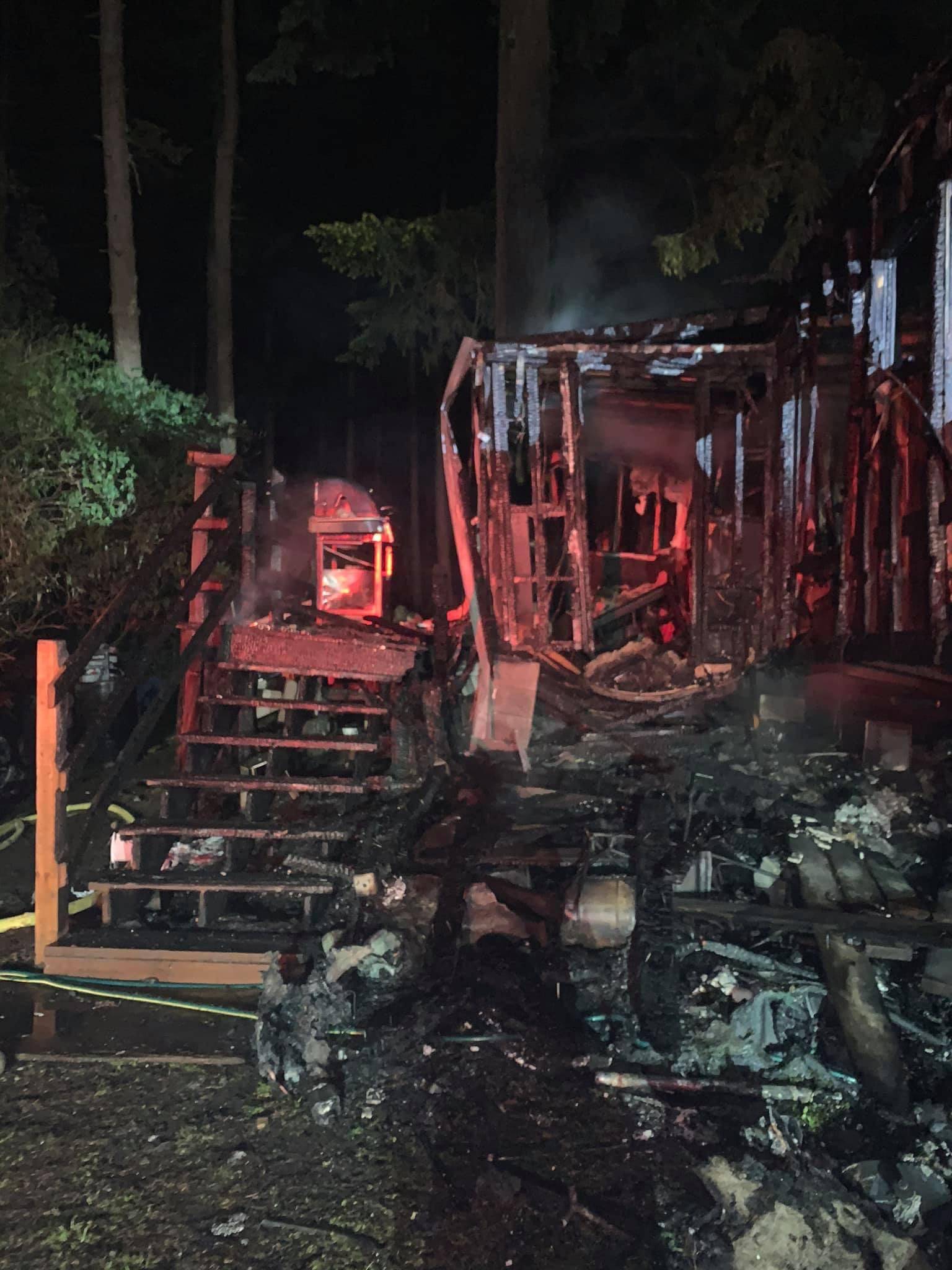 A fire swept through a family’s home on North Oak Harbor Road Sunday, May 30. (North Whidbey Fire and Rescue photo)