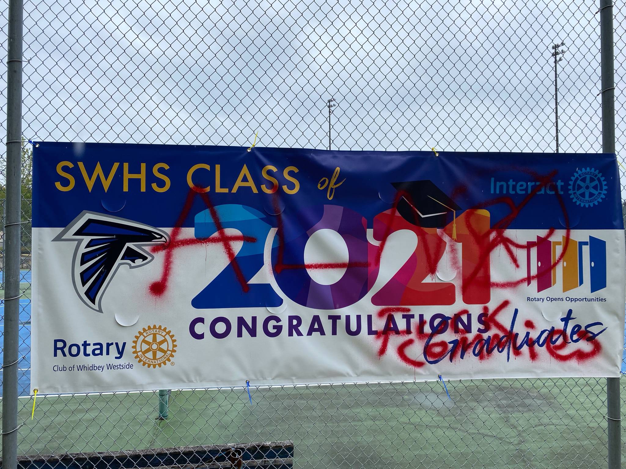 A banner celebrating the South Whidbey High School class of 2021 was vandalized, and the Black Lives Matter banner next to it was stolen. (Photo provided by Josephine Moccia)